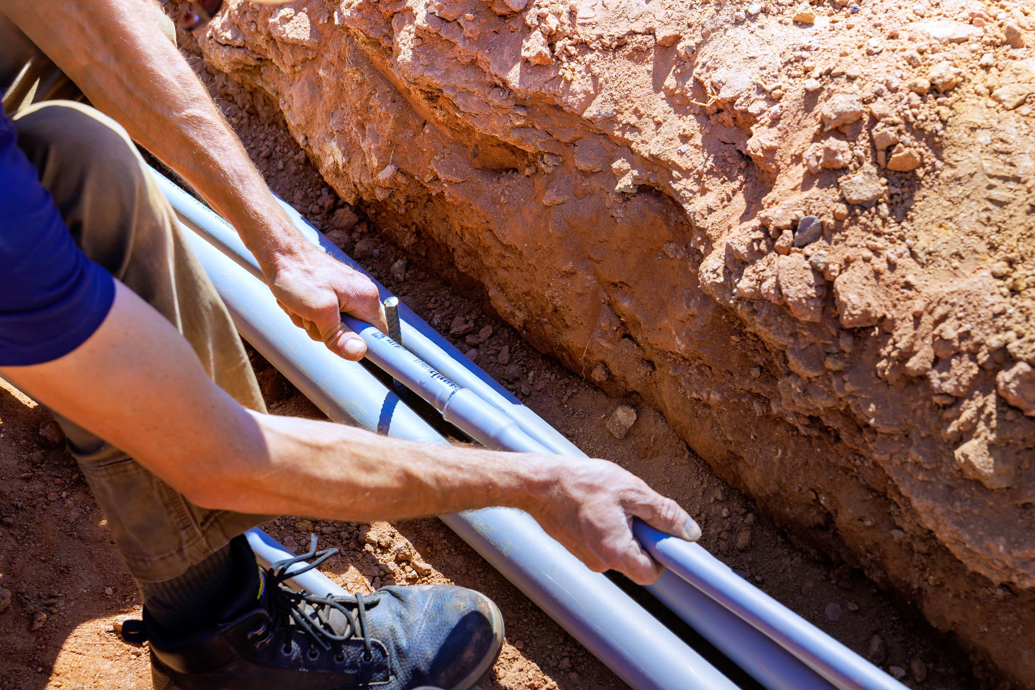 Worker handling underground cables